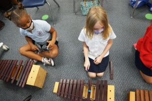 St. Timothy's students playing xylophone in music class