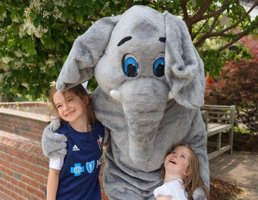 St. Timothy's students posing with our mascot