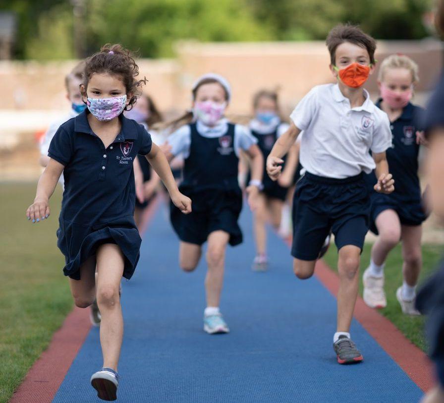 Students running on the school track