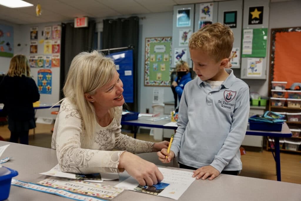 St. Timothy's teacher and student in the classroom