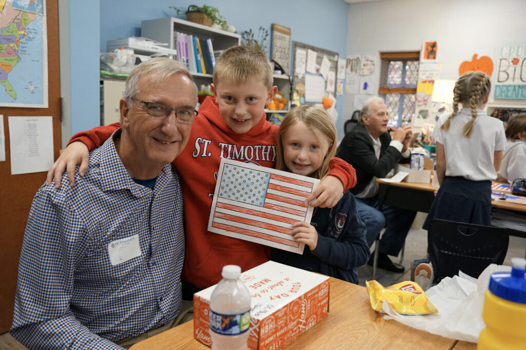 Veterans visit St. Timothy's on Veterans Day and doing crafts