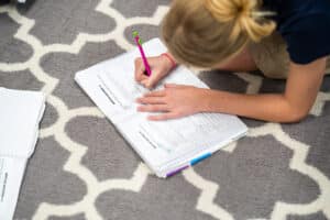 Student filling out a worksheet in class