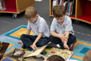 Two St. Timothy's students reading in the library